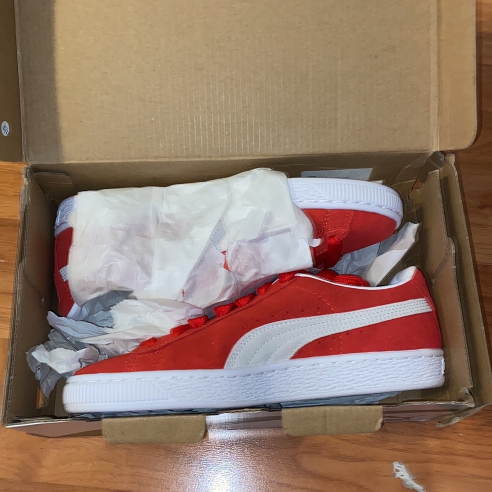 Red and white puma sneakers